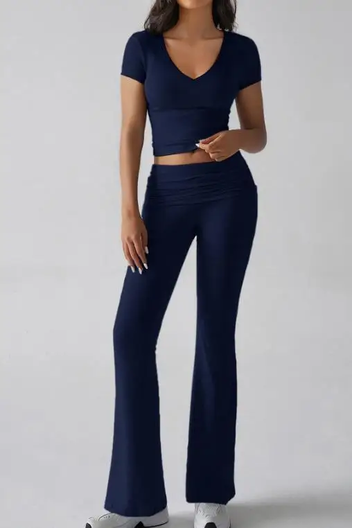 Summer New Solid Color Simple Women's Sports 2-Piece Set V-Neck Slim Fit Crop Exposed Short Sleeved T-Shirt Flared Pants Set
Summer New Solid Color Simple Women's Sports 2-Piece Set V-Neck Slim Fit Crop Exposed Short Sleeved T-Shirt Flared Pants Set