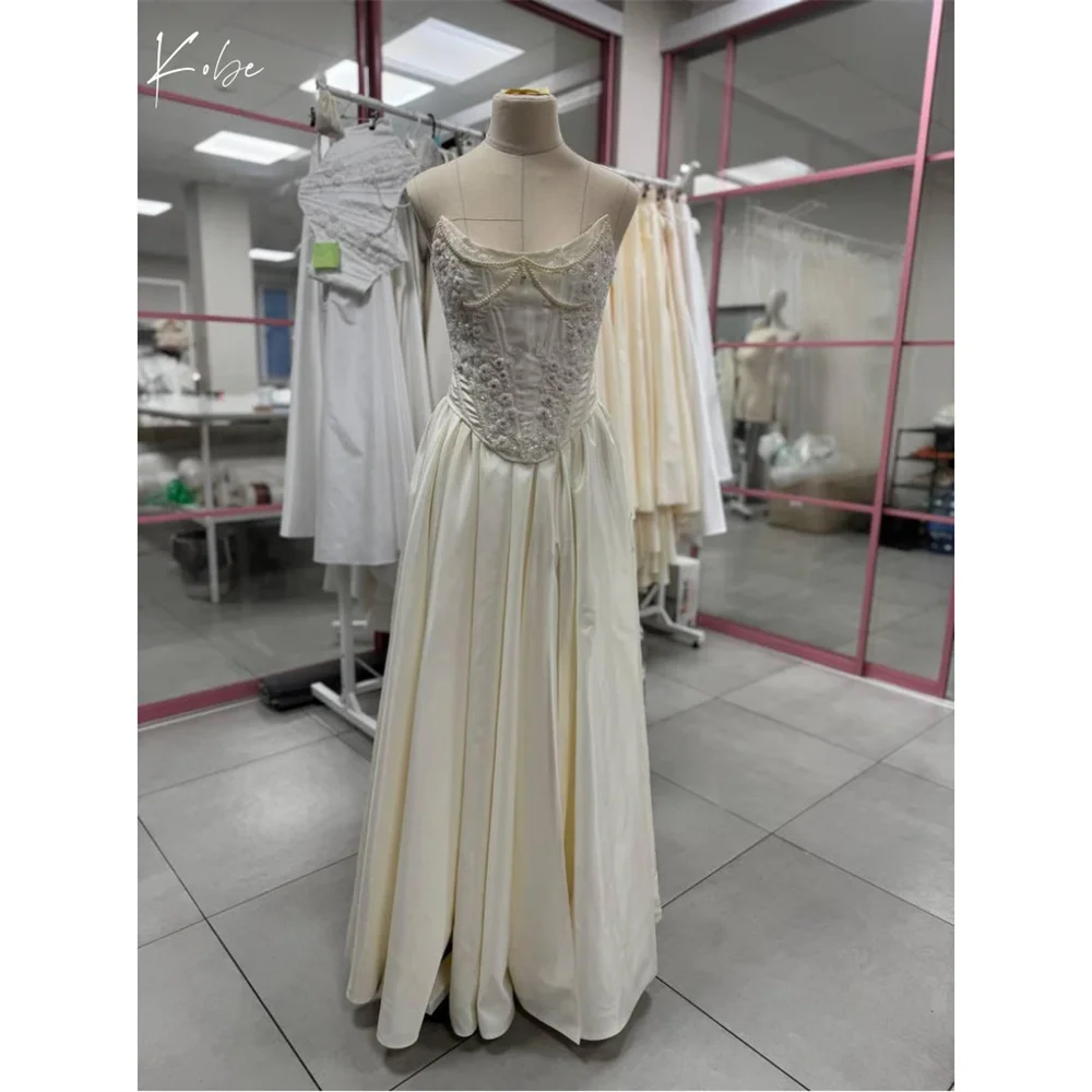 Kobe White Strapless Ball Gown Evening Dresses Lace-Up Beading Party Dresses Embroidery Customized Prom Dresses 2025
Kobe White Strapless Ball Gown Evening Dresses Lace-Up Beading Party Dresses Embroidery Customized Prom Dresses 2025