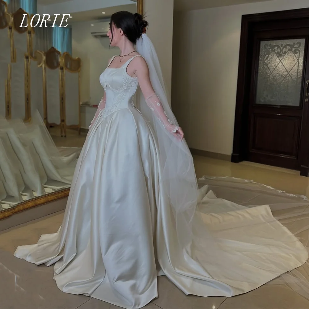 LORIE Luxury 3D A Line Wedding Dress Square Collar Bridal Dresses Appliques Flower Spaghetti Strap Wedding Gown Customized 2026
LORIE Luxury 3D A Line Wedding Dress Square Collar Bridal Dresses Appliques Flower Spaghetti Strap Wedding Gown Customized 2026
