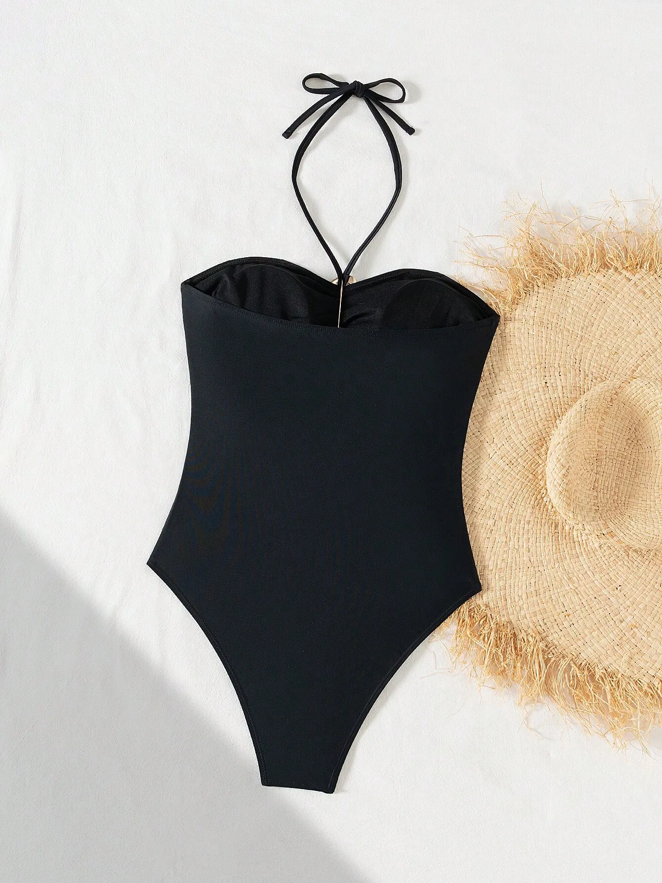Elegant Halter Neck One-Piece Swimsuit With Gold Ring Detail Black Solid
Elegant Halter Neck One-Piece Swimsuit With Gold Ring Detail Black Solid