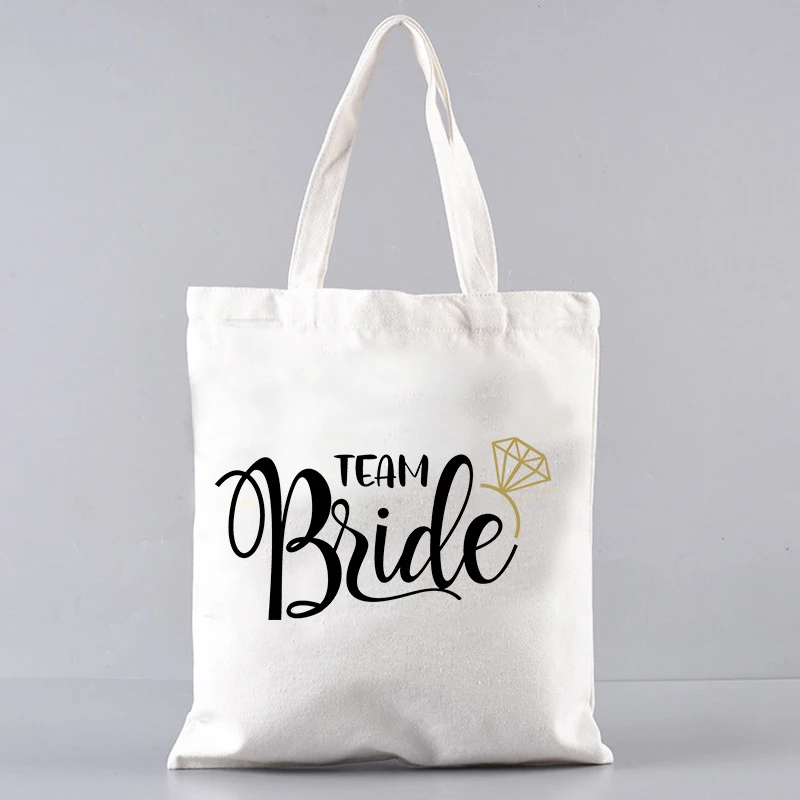 Женская повседневная сумка для покупок, подарок для невесты на свадьбу, сумка через плечо для подружки невесты, вместительная складная экологичная холщовая сумка
Женская повседневная сумка для покупок, подарок для невесты на свадьбу, сумка через плечо для подружки невесты, вместительная складная экологичная холщовая сумка