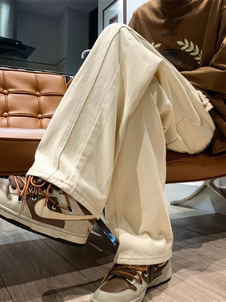 Джинсы цвета хаки для мужчин, весенне-осенние свободные брюки прямого кроя с широкими штанинами, повседневные брюки, модные, универсальные, удобные брюки
Джинсы цвета хаки для мужчин, весенне-осенние свободные брюки прямого кроя с широкими штанинами, повседневные брюки, модные, универсальные, удобные брюки