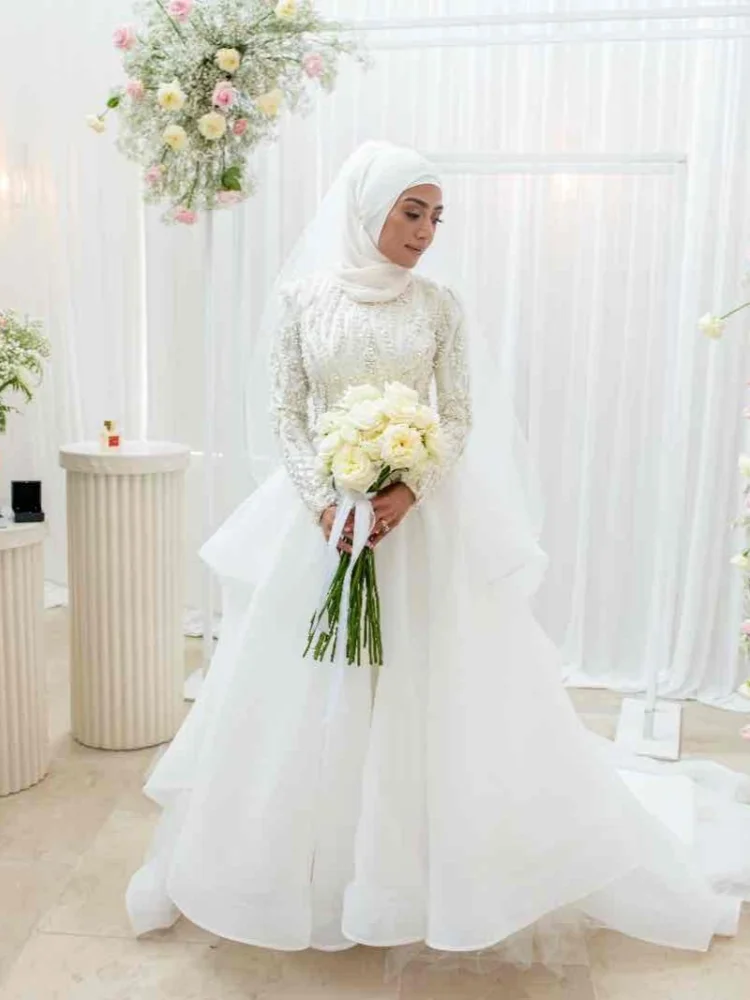 Custom Women's 2026 Islamic Style Wedding Dress Luxury Long Sleeve High Collar Pearl Water Diamond Decoration Vestido de Novia
Custom Women's 2026 Islamic Style Wedding Dress Luxury Long Sleeve High Collar Pearl Water Diamond Decoration Vestido de Novia