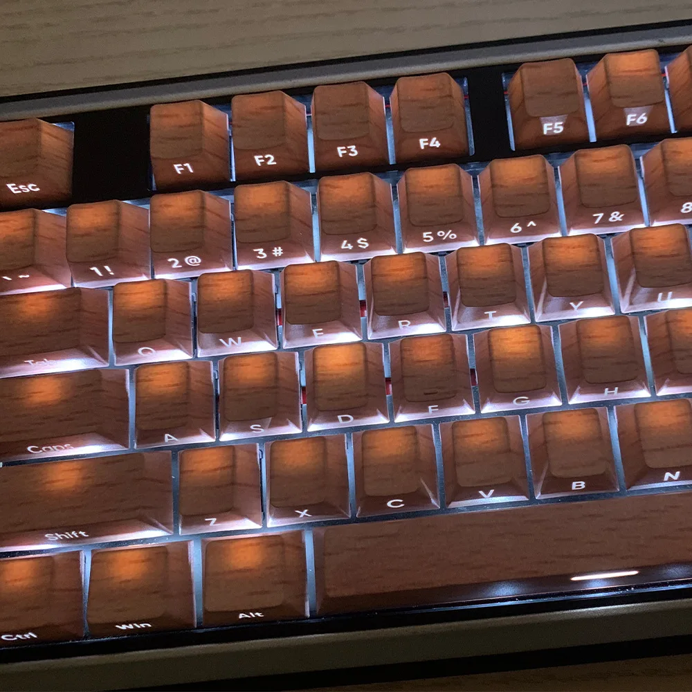 PBT five-sided sublimation printing imitation walnut yellow pear beech texture light-transmitting keycap mechanical keyboard hat
PBT five-sided sublimation printing imitation walnut yellow pear beech texture light-transmitting keycap mechanical keyboard hat