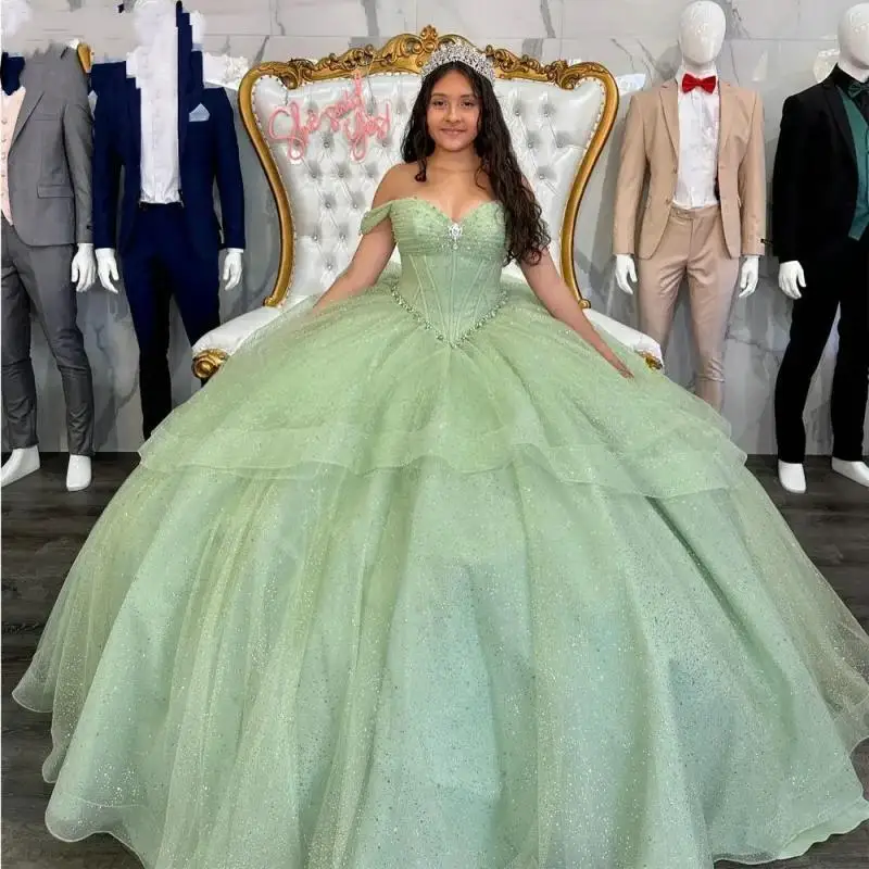 Glitter Ruffles Ball Gown Sweet 15 Year Old Quinceanera Dresses With Bow Sage Green Formal Party Gown For Women
Glitter Ruffles Ball Gown Sweet 15 Year Old Quinceanera Dresses With Bow Sage Green Formal Party Gown For Women