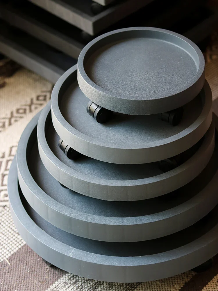 Plastic flowerpot tray with round square bottom support thickened flowerpot mobile universal wheel base with pulley roller.
Plastic flowerpot tray with round square bottom support thickened flowerpot mobile universal wheel base with pulley roller.