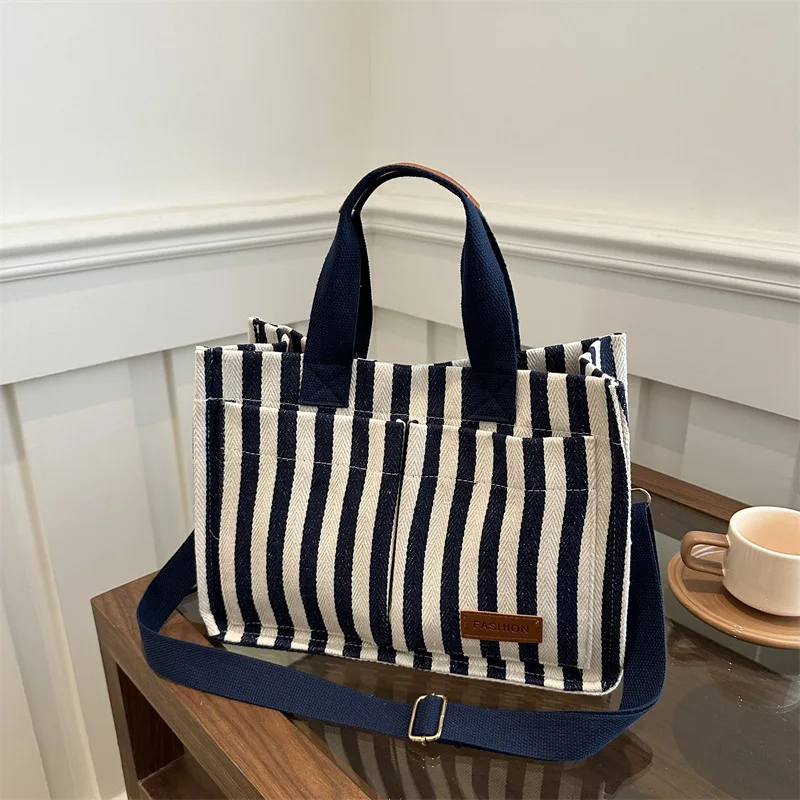 New Commuter Large Capacity Leisure Personalized Popular Striped Canvas Fashion Crossbody Portable Shoulder Tote Bag
New Commuter Large Capacity Leisure Personalized Popular Striped Canvas Fashion Crossbody Portable Shoulder Tote Bag