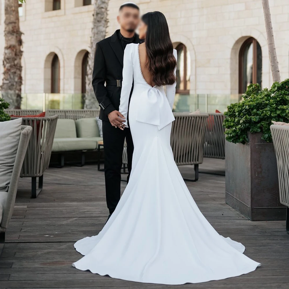 Свадебное платье русалки с открытой спиной и кристаллами Бато с длинными рукавами, большой бант, труба, элегантные свадебные платья для женщин
Свадебное платье русалки с открытой спиной и кристаллами Бато с длинными рукавами, большой бант, труба, элегантные свадебные платья для женщин