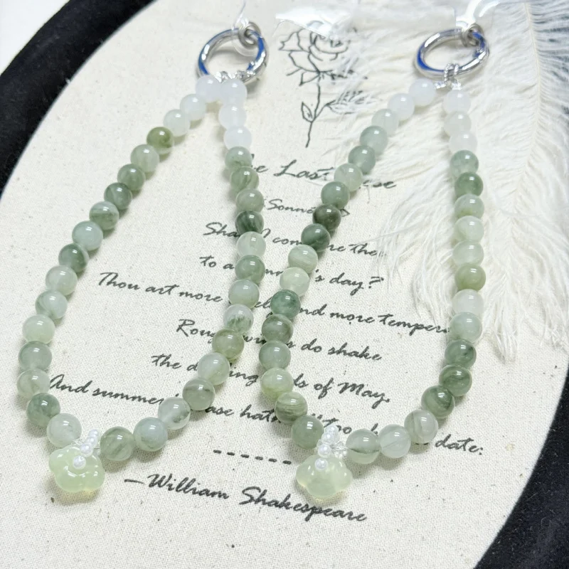 Natural Tianshan Jade Peace lock Carving Gradient Style Handmade Crystal Beaded Phone Case Pendant Keychain with Elegant Charm
Natural Tianshan Jade Peace lock Carving Gradient Style Handmade Crystal Beaded Phone Case Pendant Keychain with Elegant Charm