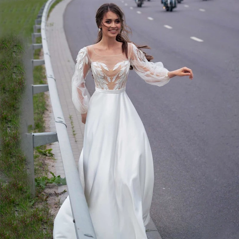 Illusion Top Scoop Long Sleeve Appliques Wedding Dress A-Line Beads Button WIth Zipper Tulle Bridal Gown
Illusion Top Scoop Long Sleeve Appliques Wedding Dress A-Line Beads Button WIth Zipper Tulle Bridal Gown