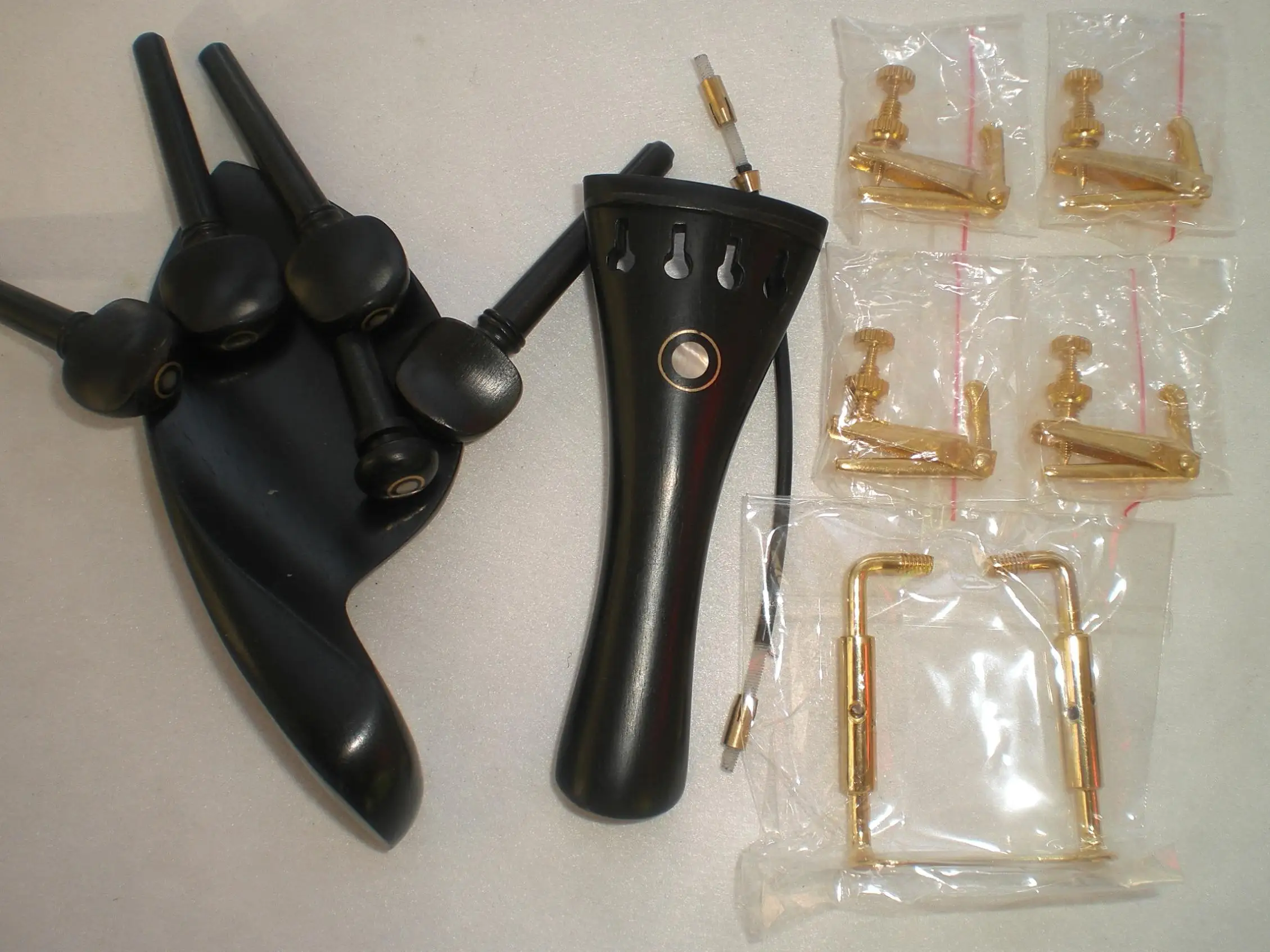 1 Set Ebony Violin Fine With 4 Fine Tuners Gold Color Chin Rest Clamp and 1 Nylon Gut All 4/4
1 Set Ebony Violin Fine With 4 Fine Tuners Gold Color Chin Rest Clamp and 1 Nylon Gut All 4/4