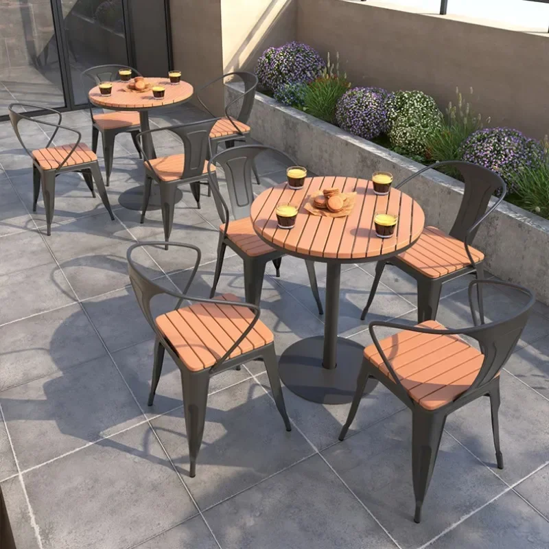 Outdoor simple plastic wood table and chair combination courtyard balcony open-air leisure table and chair milk tea shop commerc 
Outdoor simple plastic wood table and chair combination courtyard balcony open-air leisure table and chair milk tea shop commerc