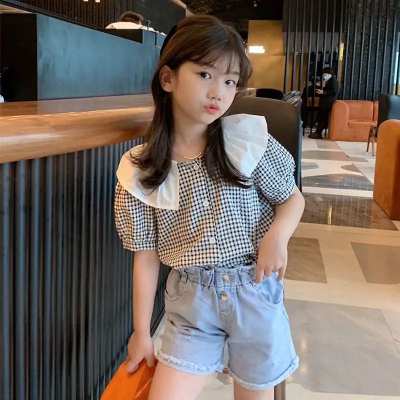 Girls' checkered shirt black retro short sleeved 2026 new stylish summer outfit fashionable doll collar top
Girls' checkered shirt black retro short sleeved 2026 new stylish summer outfit fashionable doll collar top
