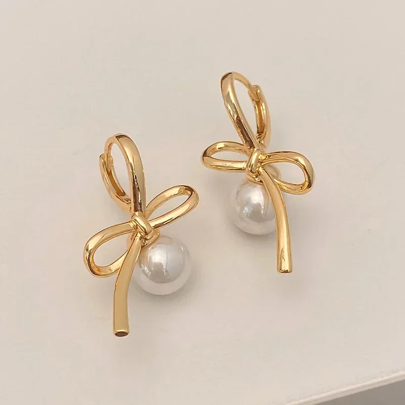 Real 925 Sterling Silver 14K Gold Pearl Hollow Bowknot Hoop Earrings for Women Minimalist Fine Jewelry Cute Accessories
Real 925 Sterling Silver 14K Gold Pearl Hollow Bowknot Hoop Earrings for Women Minimalist Fine Jewelry Cute Accessories