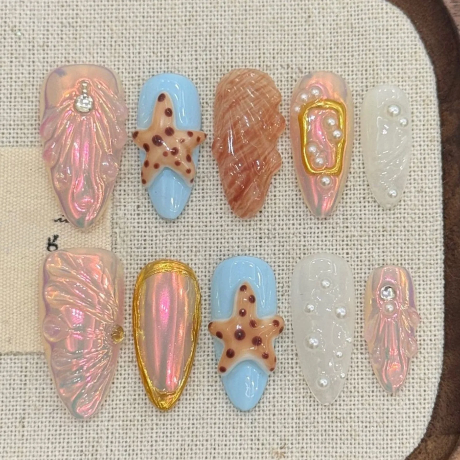 10pcs Finished Handmade False Nails Art Ocean Flower Rhinestone Mid-length Almond Fake Nail Tips Summer Seashell Press on Nails
10pcs Finished Handmade False Nails Art Ocean Flower Rhinestone Mid-length Almond Fake Nail Tips Summer Seashell Press on Nails