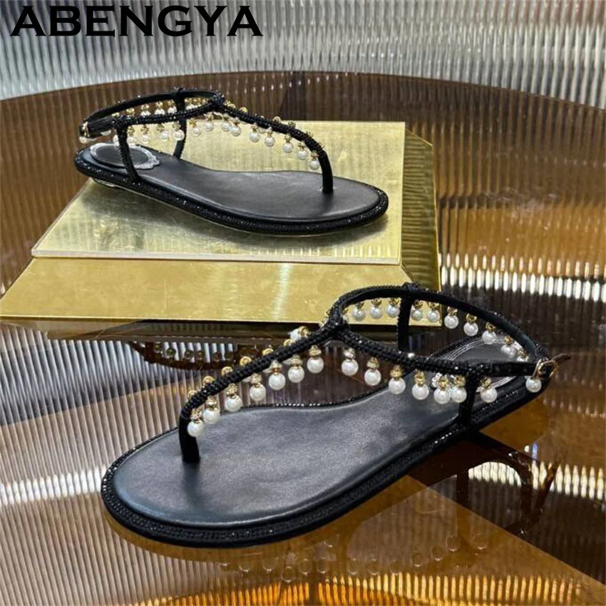 ABENGYA шлепанцы с подвеской в виде жемчуга, сандалии на плоской подошве, женские дизайнерские сандалии в этническом стиле, летняя пикантная повседневная пляжная обувь для вечеринок
ABENGYA шлепанцы с подвеской в виде жемчуга, сандалии на плоской подошве, женские дизайнерские сандалии в этническом стиле, летняя пикантная повседневная пляжная обувь для вечеринок