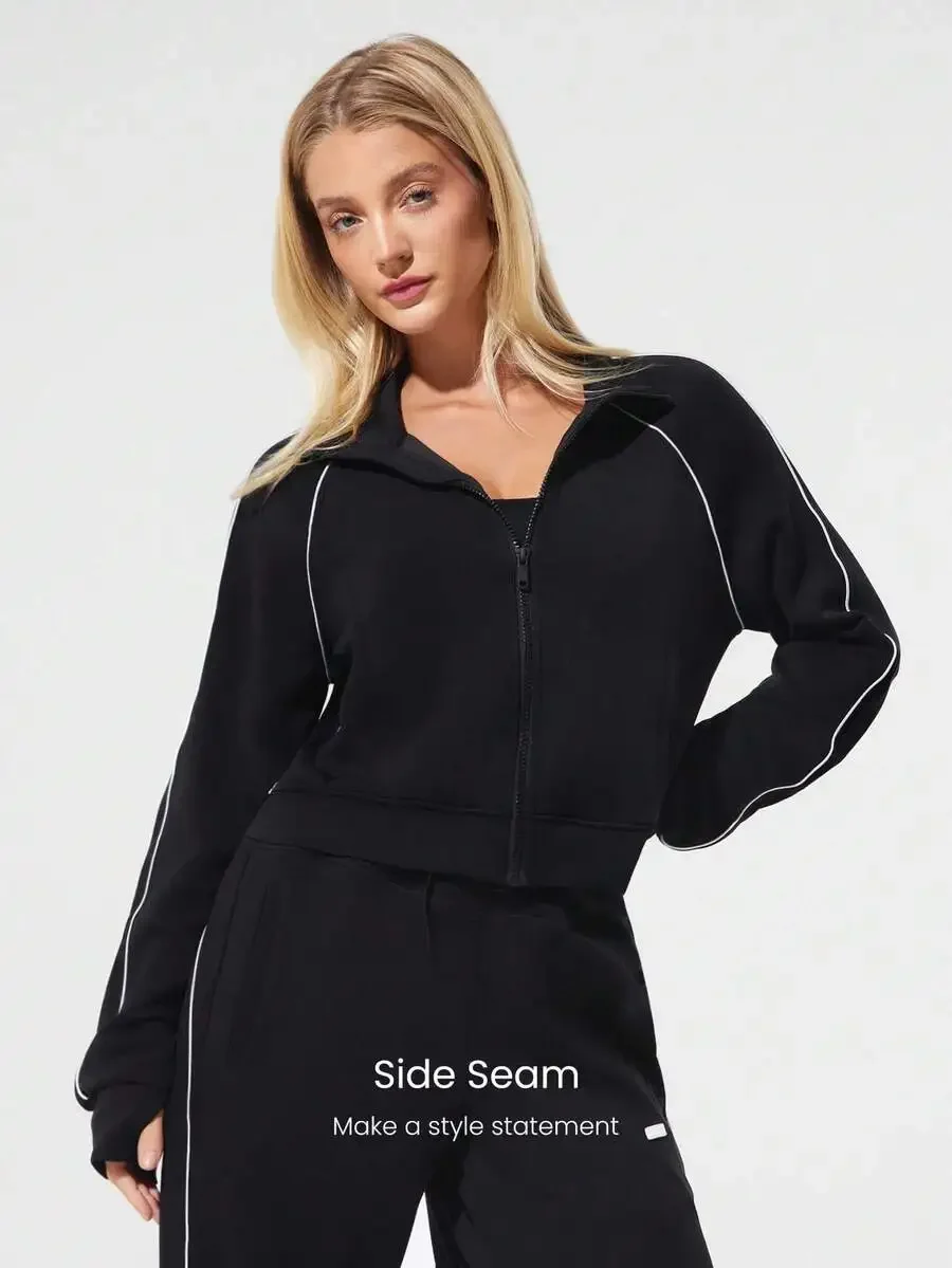 Waist-Length Fitted Zip-Up Sweatshirt With Contrast Piping And Thumbholes
Waist-Length Fitted Zip-Up Sweatshirt With Contrast Piping And Thumbholes