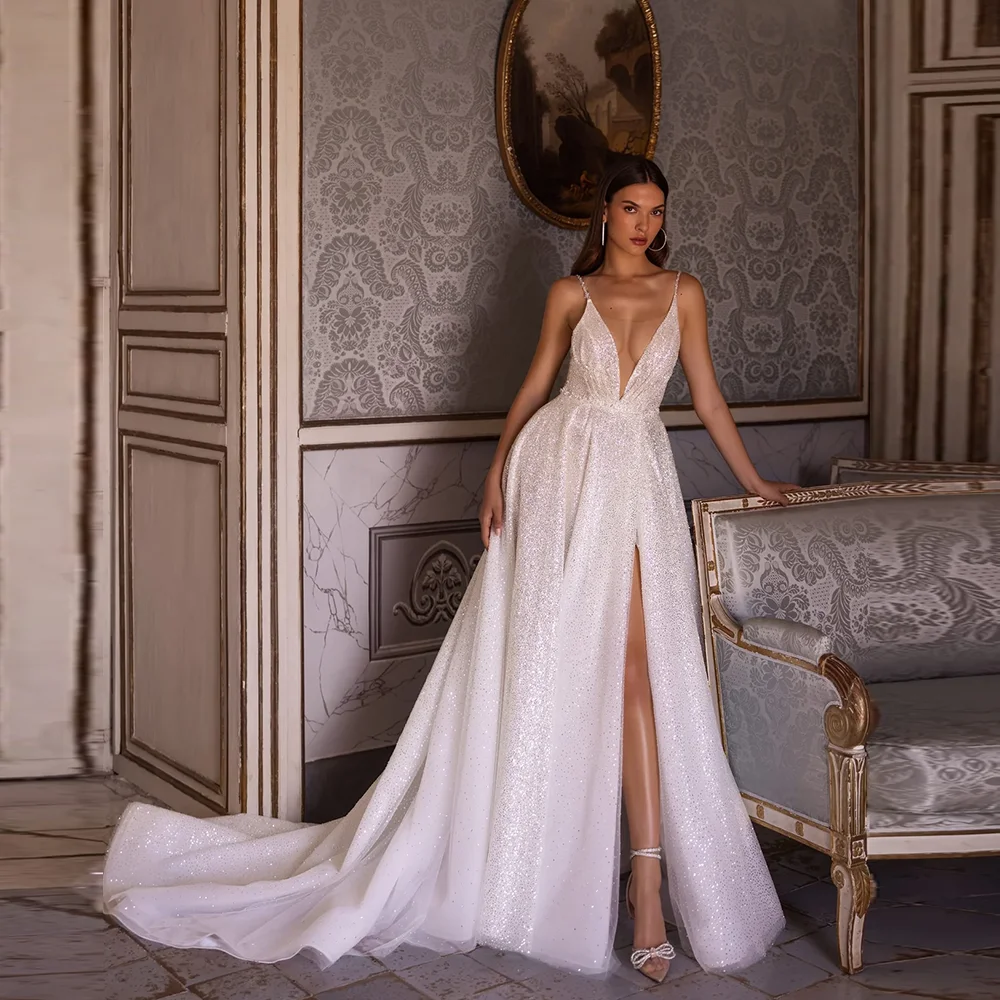 Customized Bling Spaghetti Straps Tulle Sequins Wedding Dress Side Slit Sweep Court Backless Bride Party Gown
Customized Bling Spaghetti Straps Tulle Sequins Wedding Dress Side Slit Sweep Court Backless Bride Party Gown