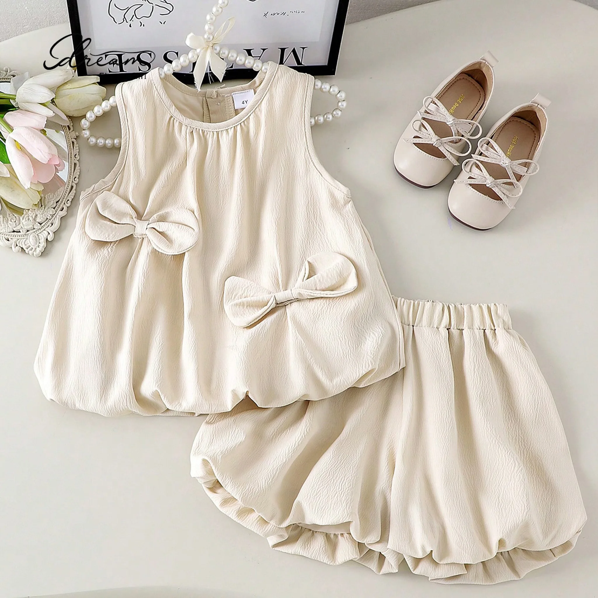 Ivory round-neck sleeveless mini dress set for girls formal occasion prom gown with bow detail
Ivory round-neck sleeveless mini dress set for girls formal occasion prom gown with bow detail