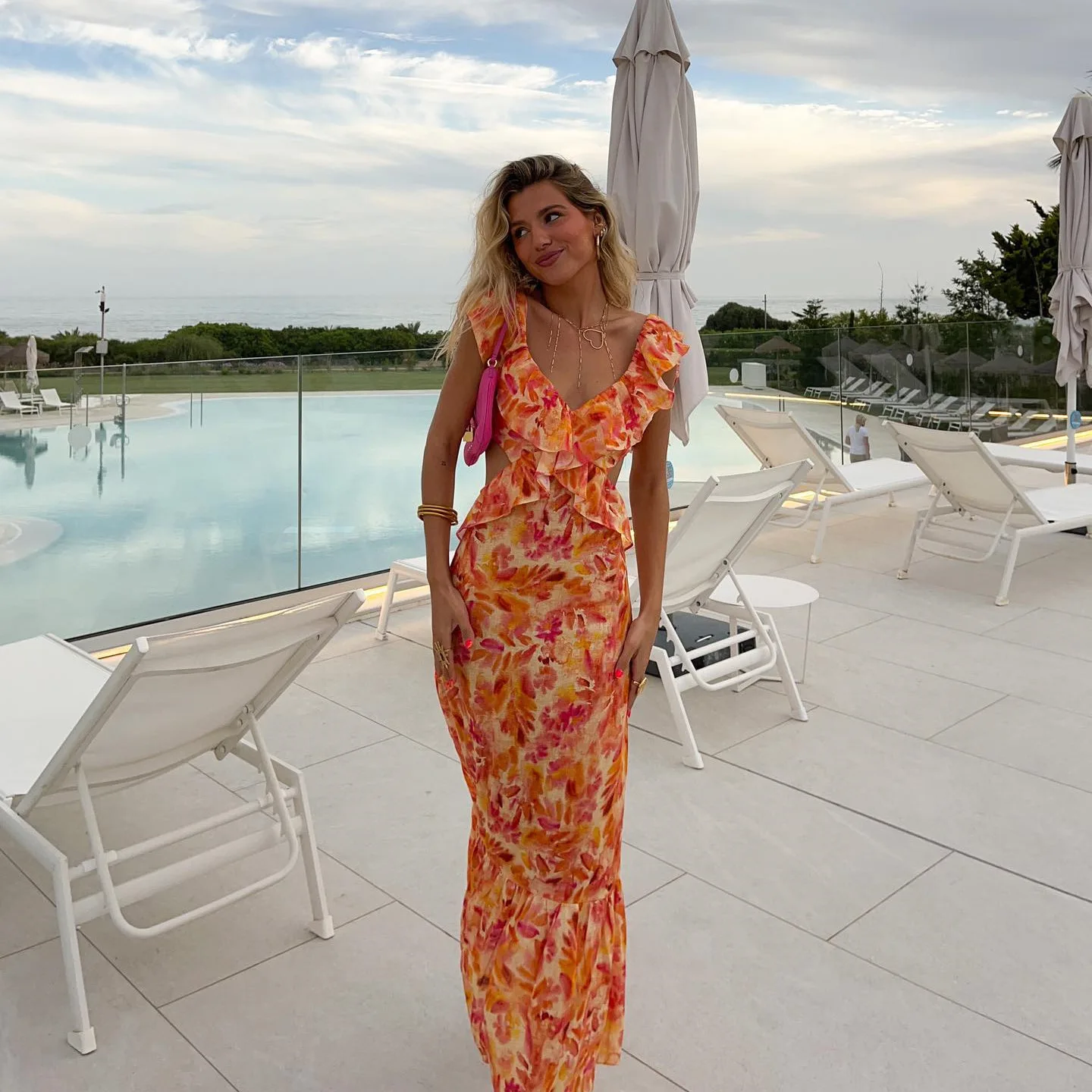 Strap dress with summer design featuring niche cross-shaped ruffled border and floral print long dress for women
Strap dress with summer design featuring niche cross-shaped ruffled border and floral print long dress for women