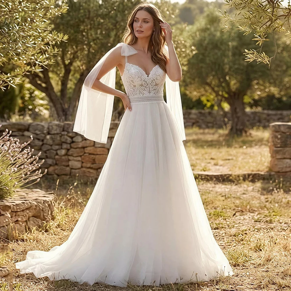 Bohemian A-Line Tulle Spaghetti Straps with Ribbons Wedding Dress Customized Lace Appliques Sweetheart Backless Bridal Gowns
Bohemian A-Line Tulle Spaghetti Straps with Ribbons Wedding Dress Customized Lace Appliques Sweetheart Backless Bridal Gowns