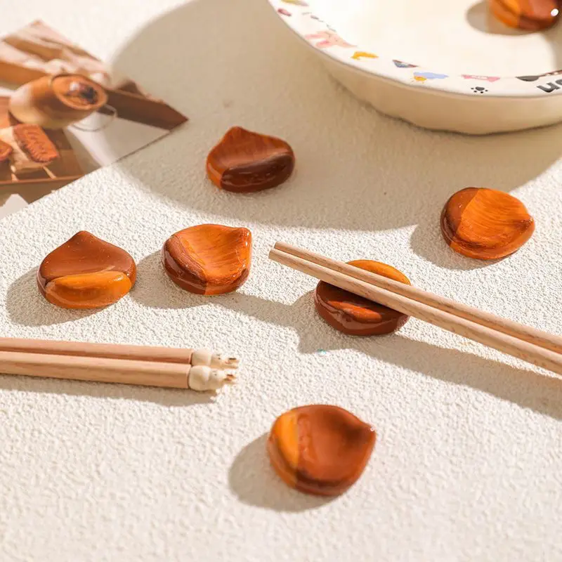 Ceramic Chestnut Shaped Chopstick Holder, Household Cute And Creative Chopstick Pillow
Ceramic Chestnut Shaped Chopstick Holder, Household Cute And Creative Chopstick Pillow