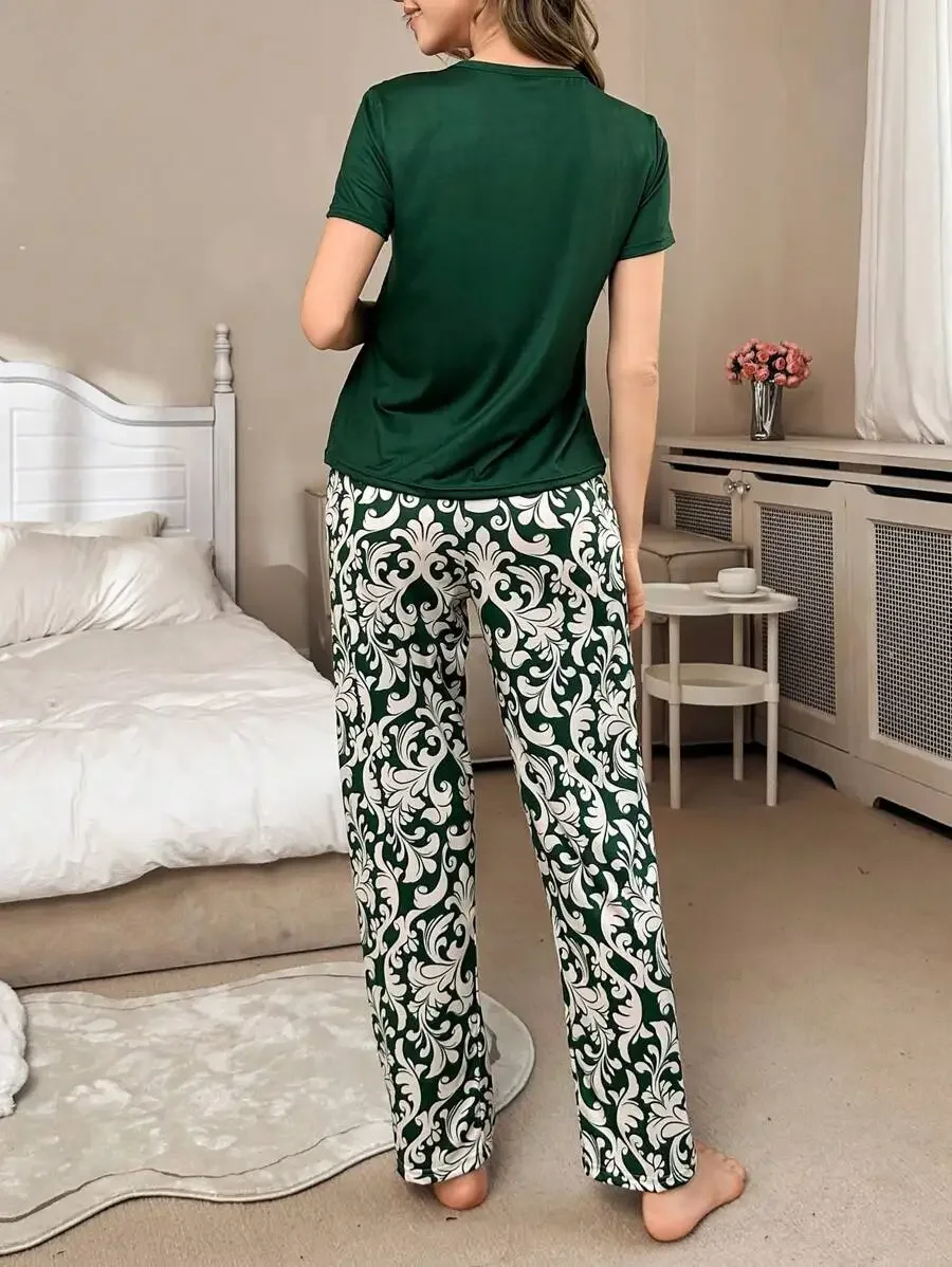 Women Solid Crew Neck Tee And Printed Casual Pants Pajama Set
Women Solid Crew Neck Tee And Printed Casual Pants Pajama Set