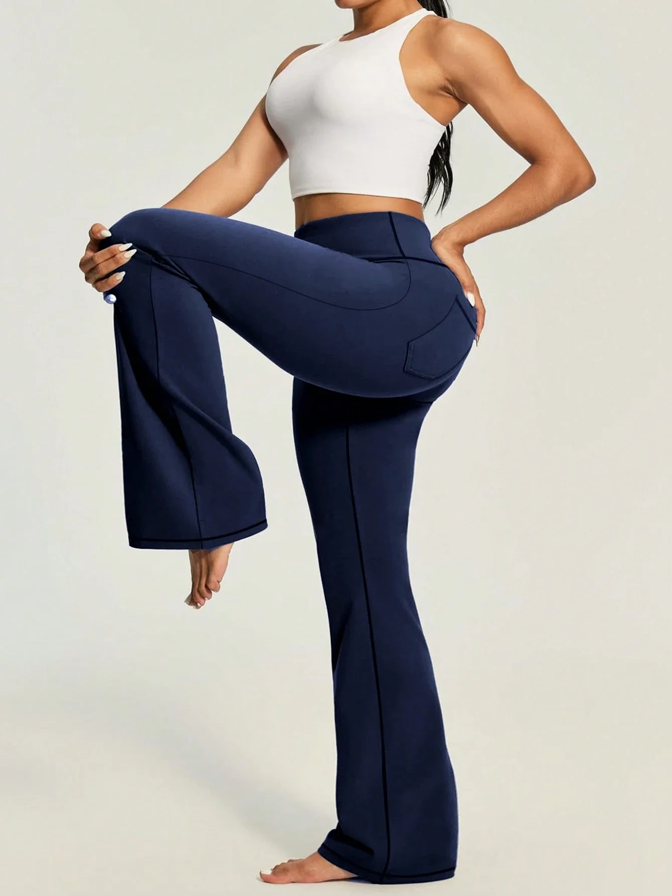 High Waist Flared Sports Pants With Side And Rear Pockets
High Waist Flared Sports Pants With Side And Rear Pockets