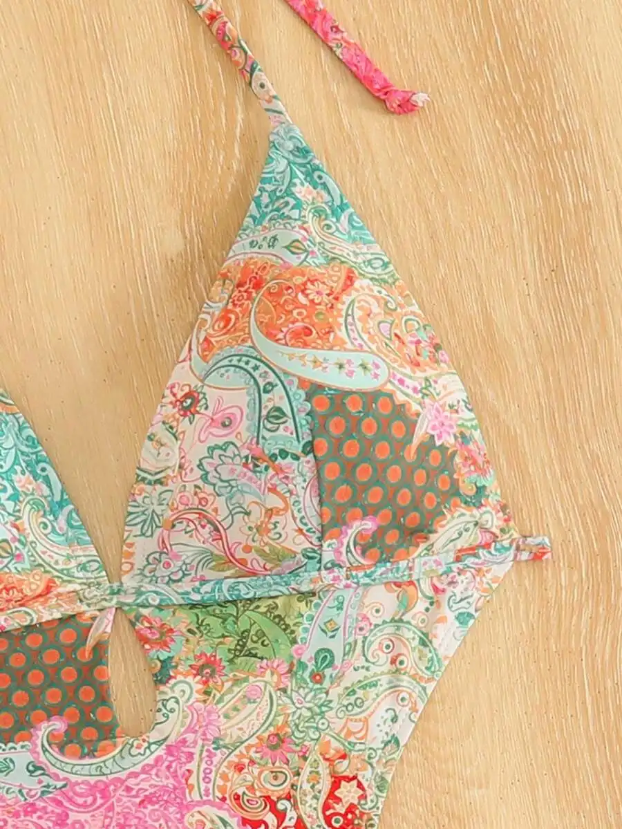 Bohemian Printed Halter Triangle One Piece Swimsuit With Hollow Out Detail For Women
Bohemian Printed Halter Triangle One Piece Swimsuit With Hollow Out Detail For Women