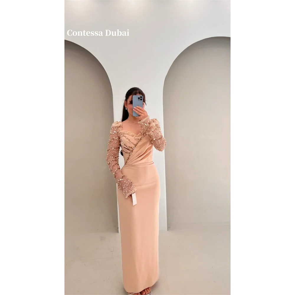 Contessa Dubai Glitter Pearl Sheath Pleat Prom Dresses V-Neck Long Sleeveفساتين سهراتZip Split Back Floor-Lengthrobes de soirée
Contessa Dubai Glitter Pearl Sheath Pleat Prom Dresses V-Neck Long Sleeveفساتين سهراتZip Split Back Floor-Lengthrobes de soirée