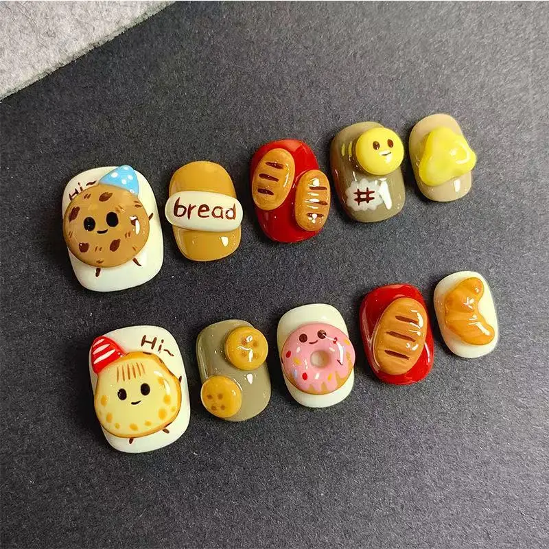 Cute handmade short nail art, cartoon biscuit bread 3D hand-painted nail art, reusable high-quality nails
Cute handmade short nail art, cartoon biscuit bread 3D hand-painted nail art, reusable high-quality nails