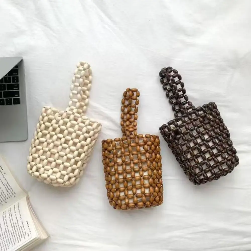 Handmade Wooden Bead Bucket Bag Hollow Woven Design Loop Handle Women Handbag with Inner Pocket Cylindrical Shape Mini Wrist Bag
Handmade Wooden Bead Bucket Bag Hollow Woven Design Loop Handle Women Handbag with Inner Pocket Cylindrical Shape Mini Wrist Bag