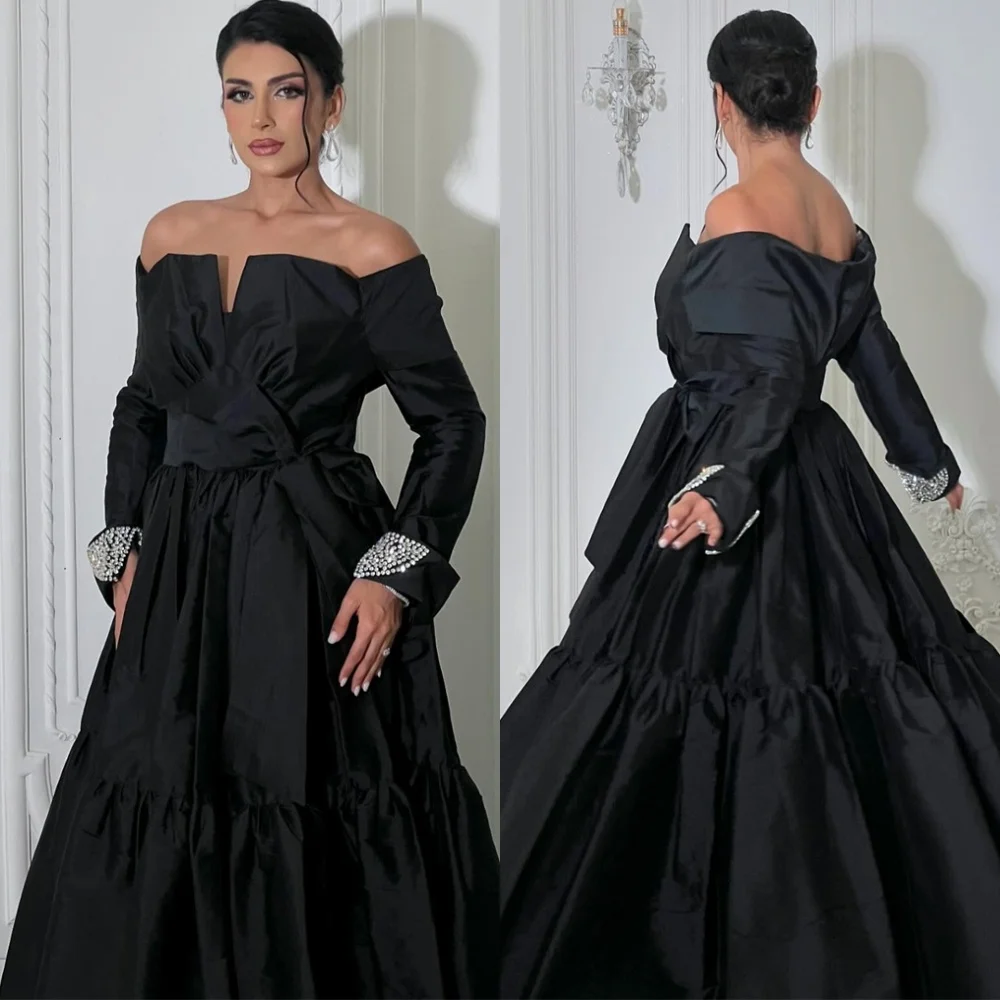 Customized Classic Black Satin Evening Dress Modern Off the Shoulder Long Sleeves Celebrity Gowns Luxury Crystal Prom Dress
Customized Classic Black Satin Evening Dress Modern Off the Shoulder Long Sleeves Celebrity Gowns Luxury Crystal Prom Dress