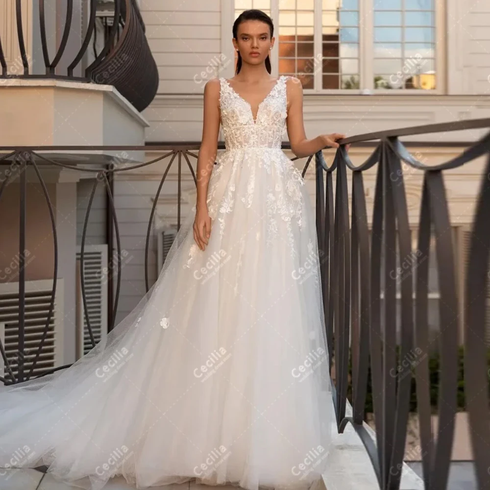 Gorgeous Wedding Dresses A-Line Tulle Tiered Bridal Gowns Lace Appliques Sleeveless Backless Robes Exquisite Vestidos De Novia 
Gorgeous Wedding Dresses A-Line Tulle Tiered Bridal Gowns Lace Appliques Sleeveless Backless Robes Exquisite Vestidos De Novia