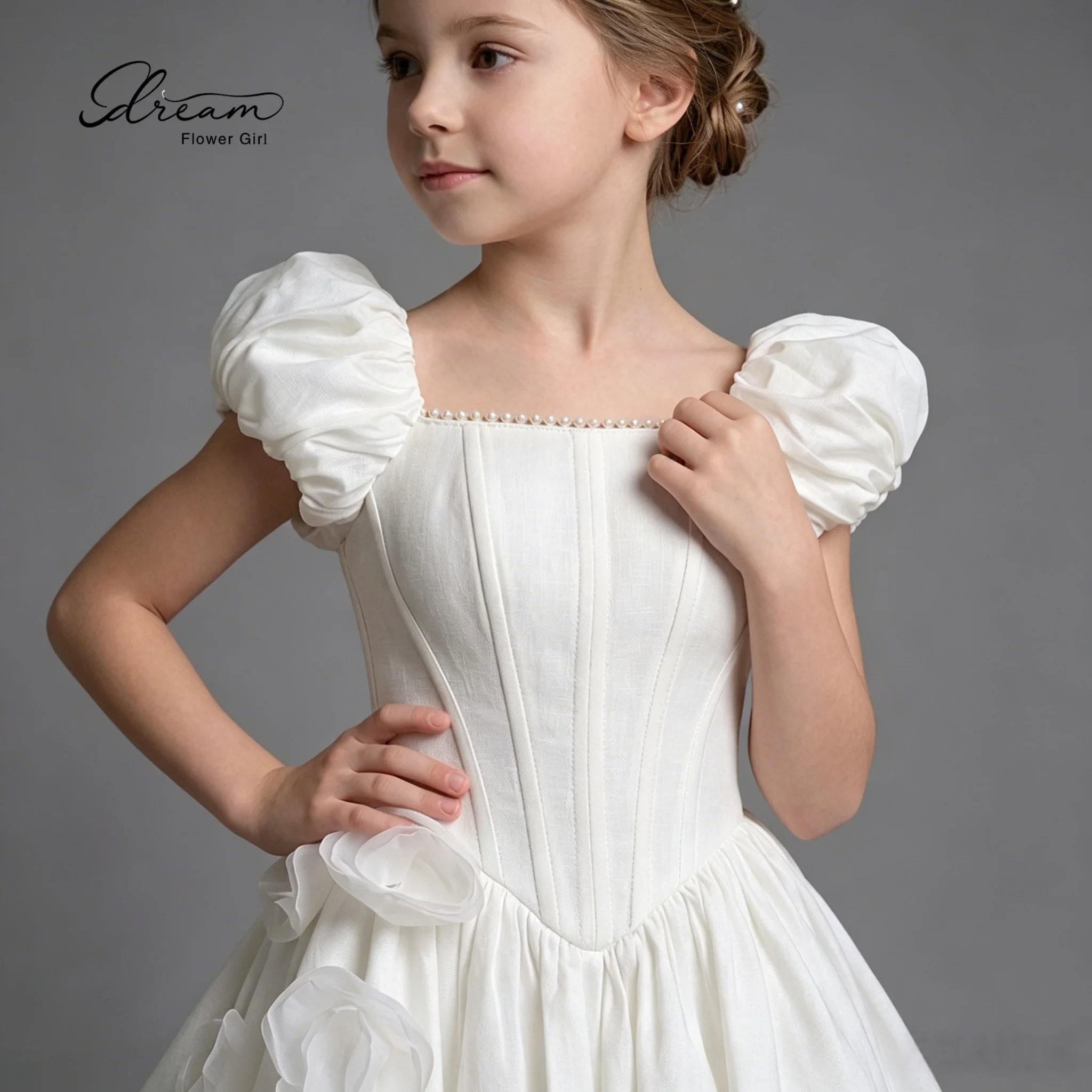 Floor-length princess-style formal ball gown for girls featuring white puff sleeves a full skirt and appliqué detailing
Floor-length princess-style formal ball gown for girls featuring white puff sleeves a full skirt and appliqué detailing