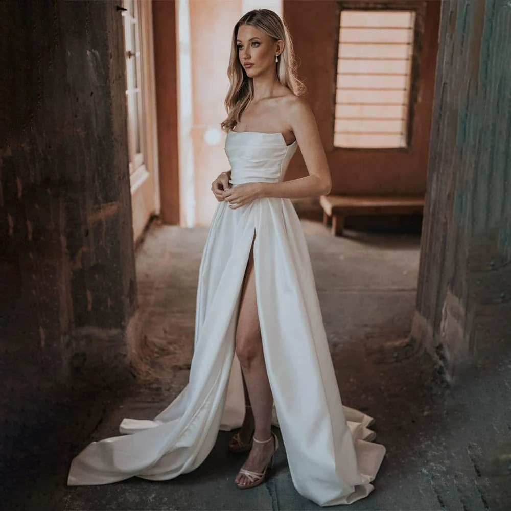 Elegant Wedding Dresses White Satin A Line Strapless Side Split Simple Wedding Gowns for Brides Sleeveless Modern Bridal Dress
Elegant Wedding Dresses White Satin A Line Strapless Side Split Simple Wedding Gowns for Brides Sleeveless Modern Bridal Dress