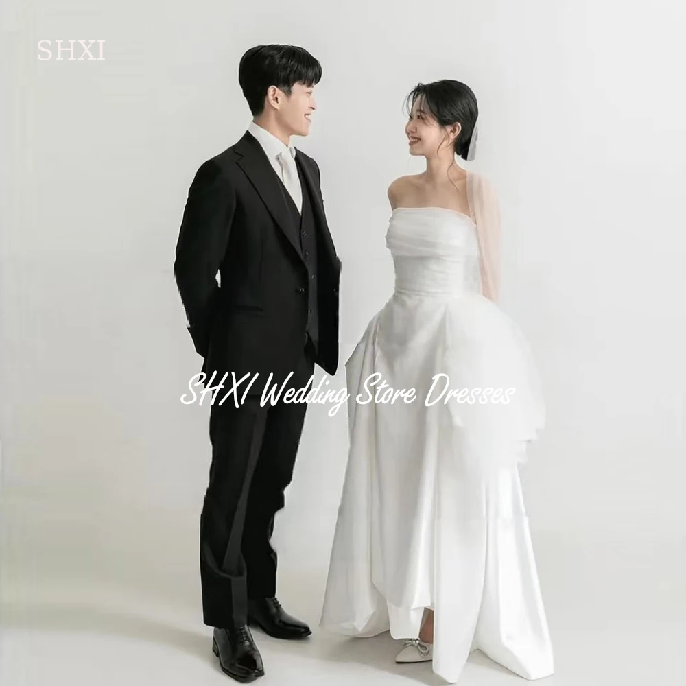 SHXI Elegant White Korea Wedding Dresses Organza Strapless Photo Shoot Dress Pleats Top Open Back Lace Up Bridal Gown Customized
SHXI Elegant White Korea Wedding Dresses Organza Strapless Photo Shoot Dress Pleats Top Open Back Lace Up Bridal Gown Customized