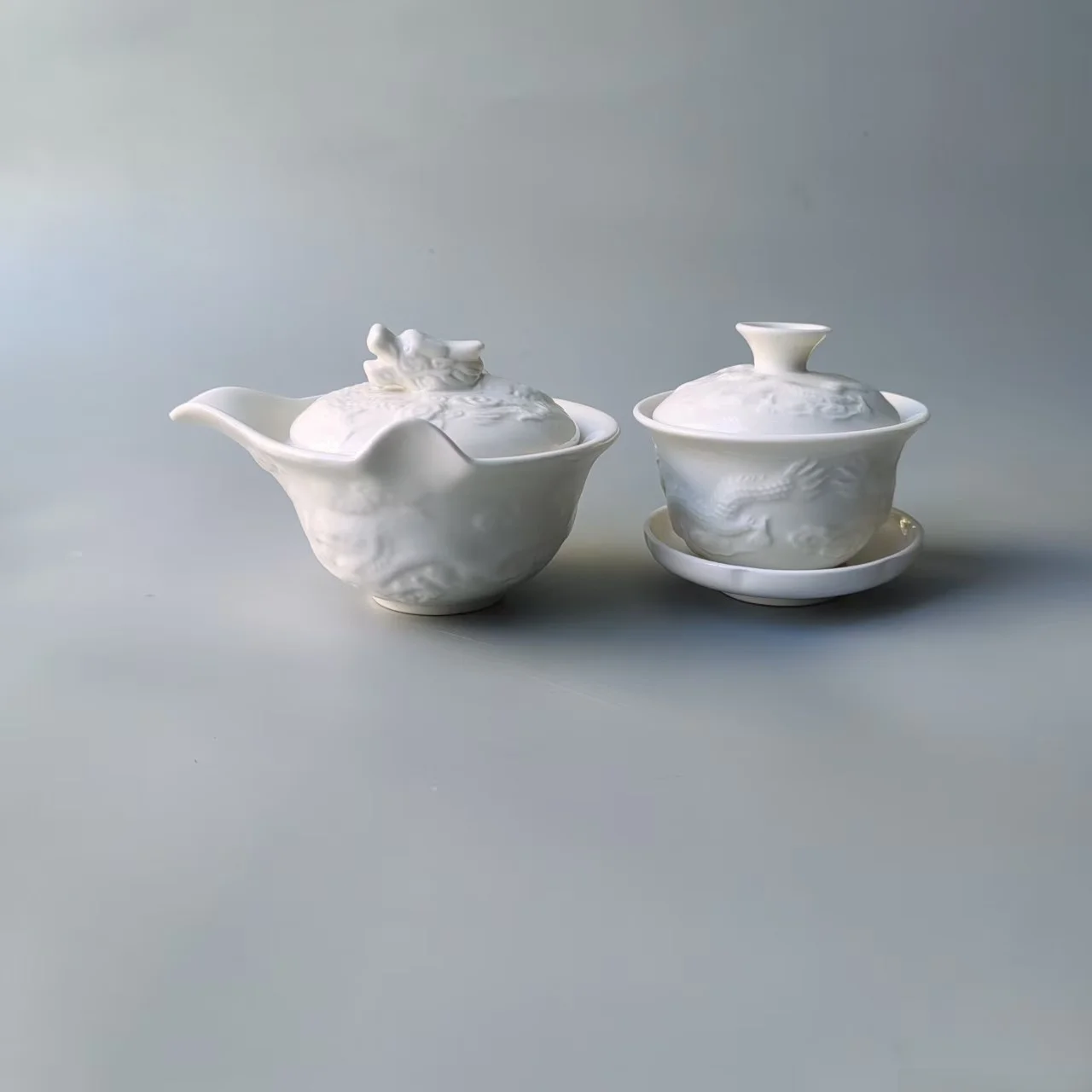 New Chinese Style Ceramic Tea Set Anti-Scalding White Relief Dragon Pattern Tea Bowl Cup Handheld Pot for Serving Tea
New Chinese Style Ceramic Tea Set Anti-Scalding White Relief Dragon Pattern Tea Bowl Cup Handheld Pot for Serving Tea