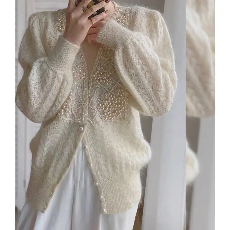Women's Knitted Hollow out Cardigan Loose Korean Chic V-Neck Knitted Sweater For Women Long Sleeve Coat Vintage Knitwear Tops
Women's Knitted Hollow out Cardigan Loose Korean Chic V-Neck Knitted Sweater For Women Long Sleeve Coat Vintage Knitwear Tops