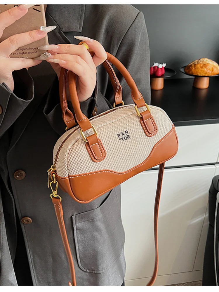 High-end sense of contrast color hand-carried bowling bag 2025 new fashion casual all-match one-shoulder messenger female bag
High-end sense of contrast color hand-carried bowling bag 2025 new fashion casual all-match one-shoulder messenger female bag