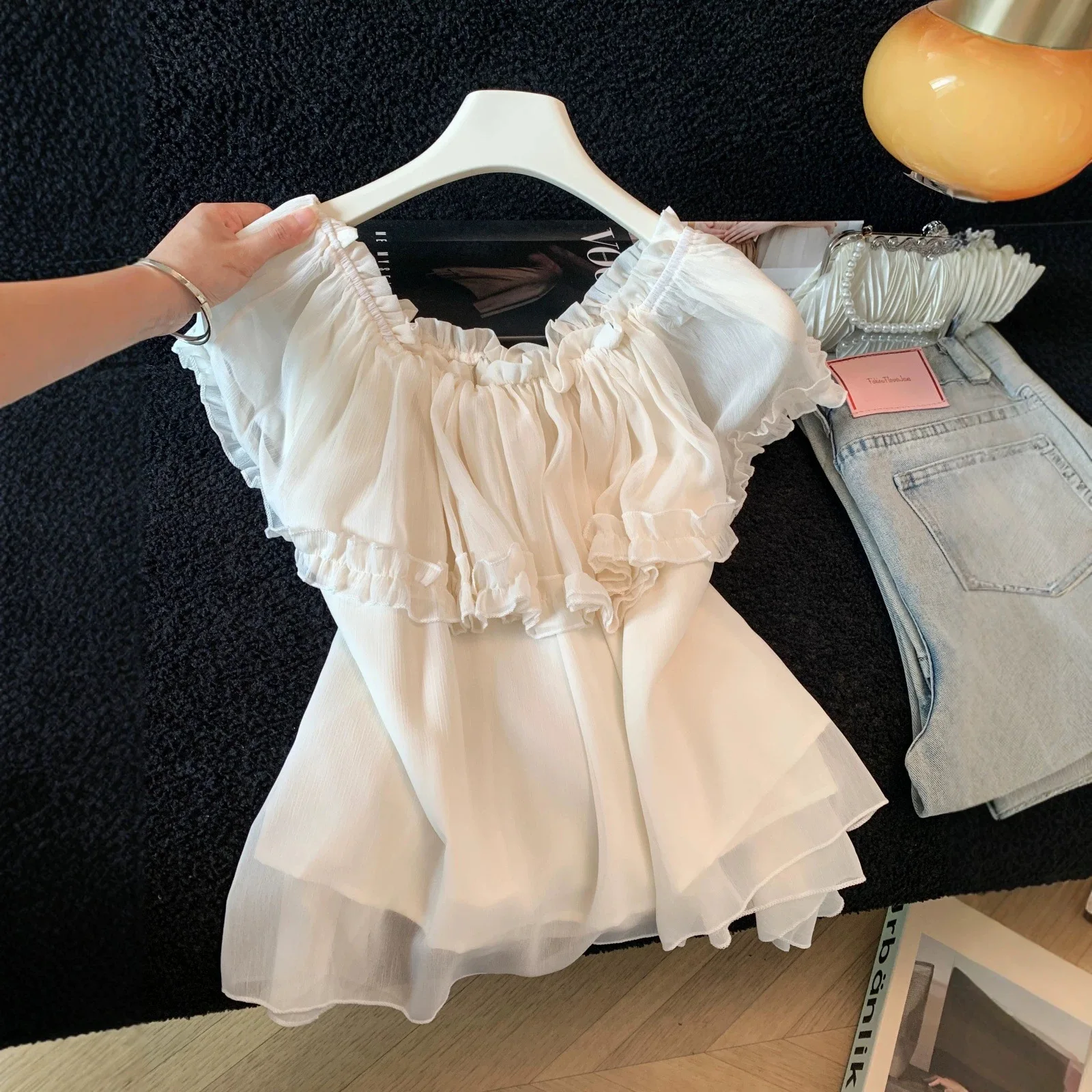 Temperament Solid Color Age-reducing Ruffle Leaf Edge One-word Shoulder Chiffon Shirt 2026 Summer Versatile Beautiful Top
Temperament Solid Color Age-reducing Ruffle Leaf Edge One-word Shoulder Chiffon Shirt 2026 Summer Versatile Beautiful Top