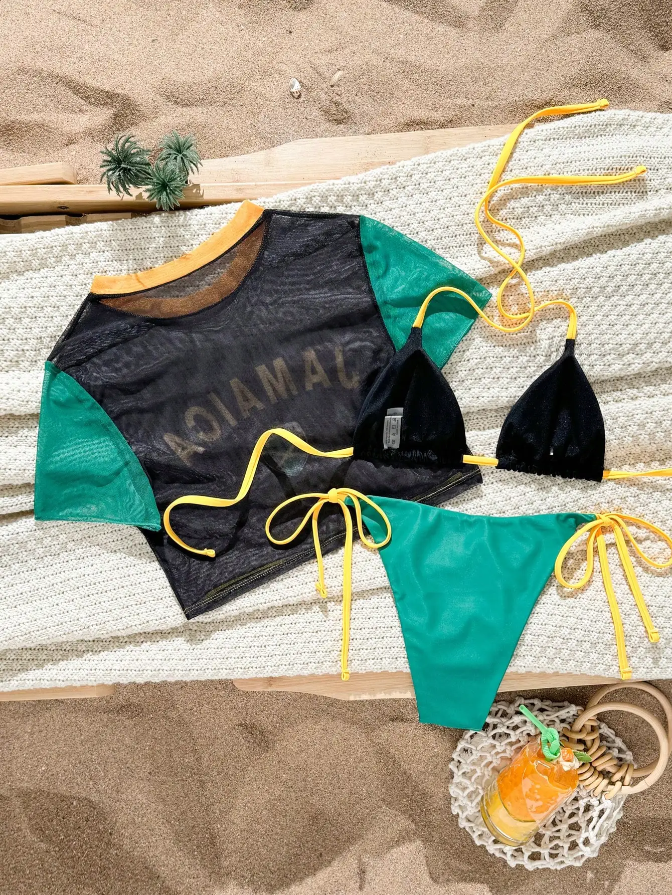 Jamaica Flag Inspired 3-Piece Beachwear Set: Triangle Bikini With Mesh Cover-Up And Solid Color Bottoms
Jamaica Flag Inspired 3-Piece Beachwear Set: Triangle Bikini With Mesh Cover-Up And Solid Color Bottoms