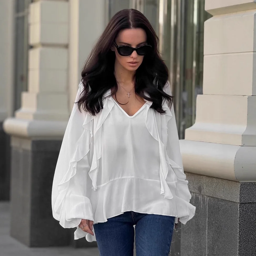 Осенняя женская блузка во французском стиле с v-образным вырезом и рюшами, расклешенными рукавами, асимметричная женская рубашка, повседневная женская рубашка в корейском стиле
Осенняя женская блузка во французском стиле с v-образным вырезом и рюшами, расклешенными рукавами, асимметричная женская рубашка, повседневная женская рубашка в корейском стиле