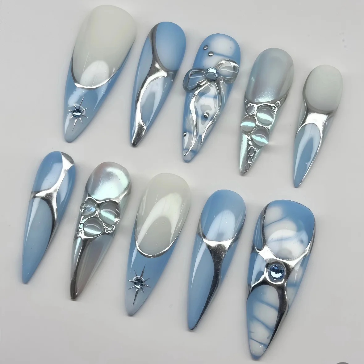 10Pcs Blue French Handmade Fake Nails Press on Silver Bow Starburst Rhinestone False Nails Long Stiletto Wearable Manicure Tips
10Pcs Blue French Handmade Fake Nails Press on Silver Bow Starburst Rhinestone False Nails Long Stiletto Wearable Manicure Tips