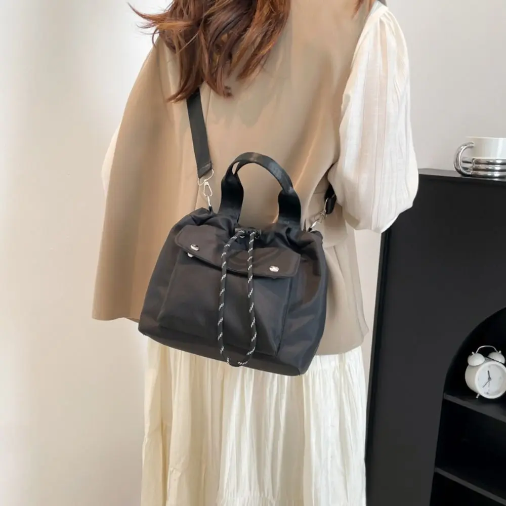 Cute Korean Style Drawstring Bucket Bag Handbag Purse Nylon Shoulder Bag Solid Color Mobile Phone Bag Small Crossbody Bag Women
Cute Korean Style Drawstring Bucket Bag Handbag Purse Nylon Shoulder Bag Solid Color Mobile Phone Bag Small Crossbody Bag Women