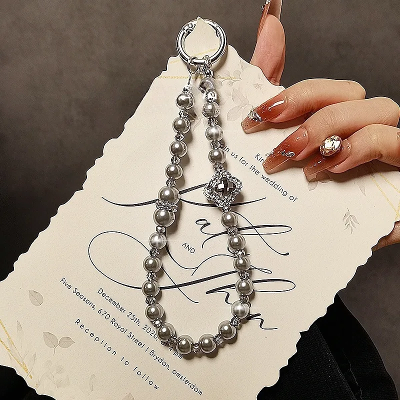 Fashion Beaded Pearl Mobile Phone Lanyard Short Keychain Pendant Elegant Accessory for Women
Fashion Beaded Pearl Mobile Phone Lanyard Short Keychain Pendant Elegant Accessory for Women