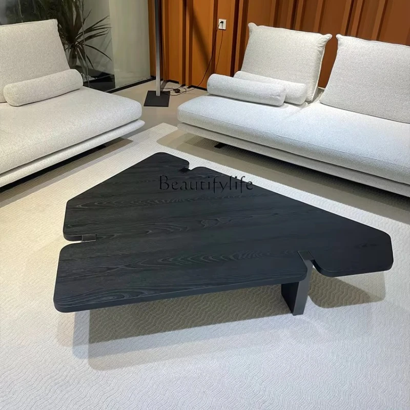 Italian minimalist irregular coffee table creative high-end black antique wooden tea table
Italian minimalist irregular coffee table creative high-end black antique wooden tea table