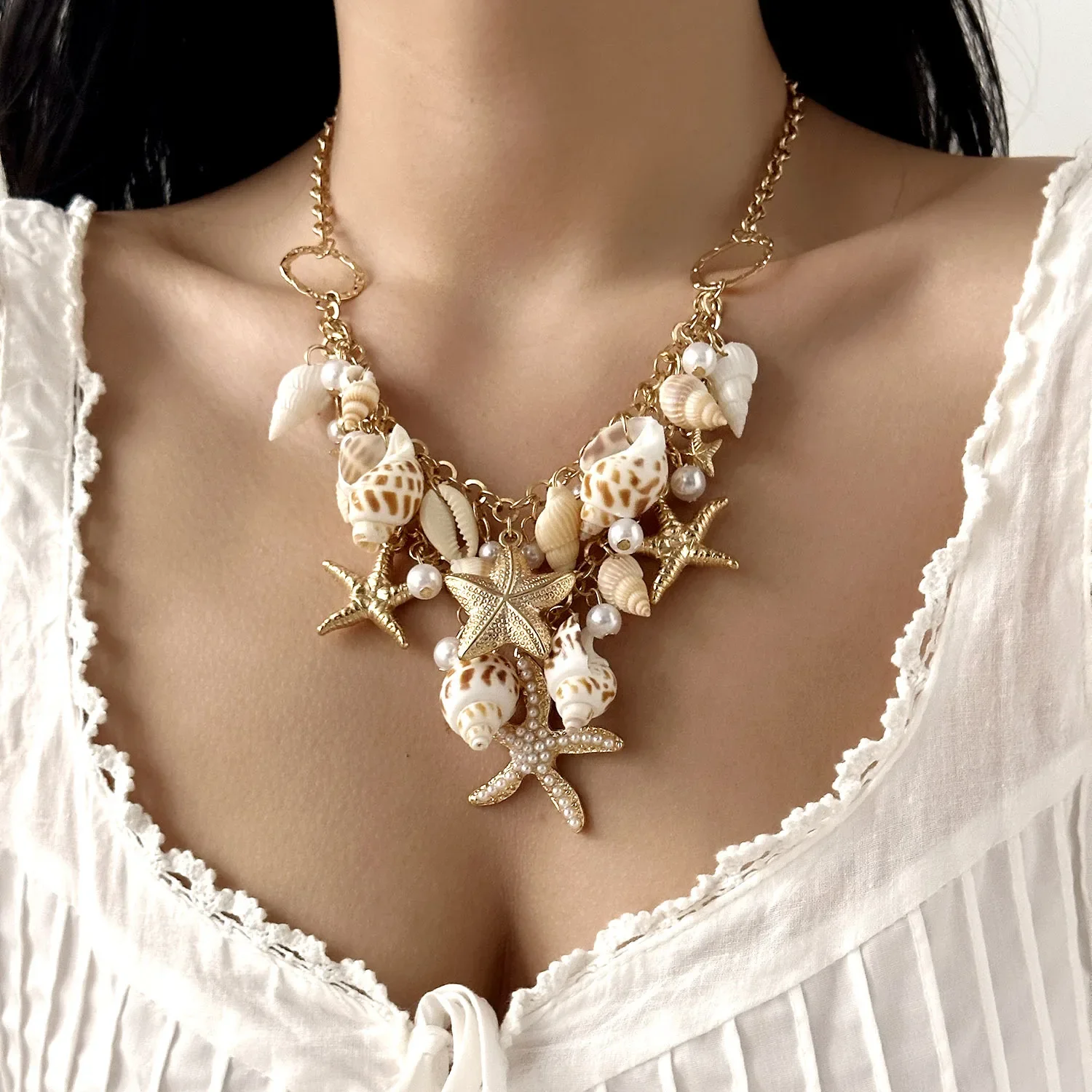 Starfish conch pearl necklace female exaggerated beach holiday style new shell single circle waist chain accessories
Starfish conch pearl necklace female exaggerated beach holiday style new shell single circle waist chain accessories