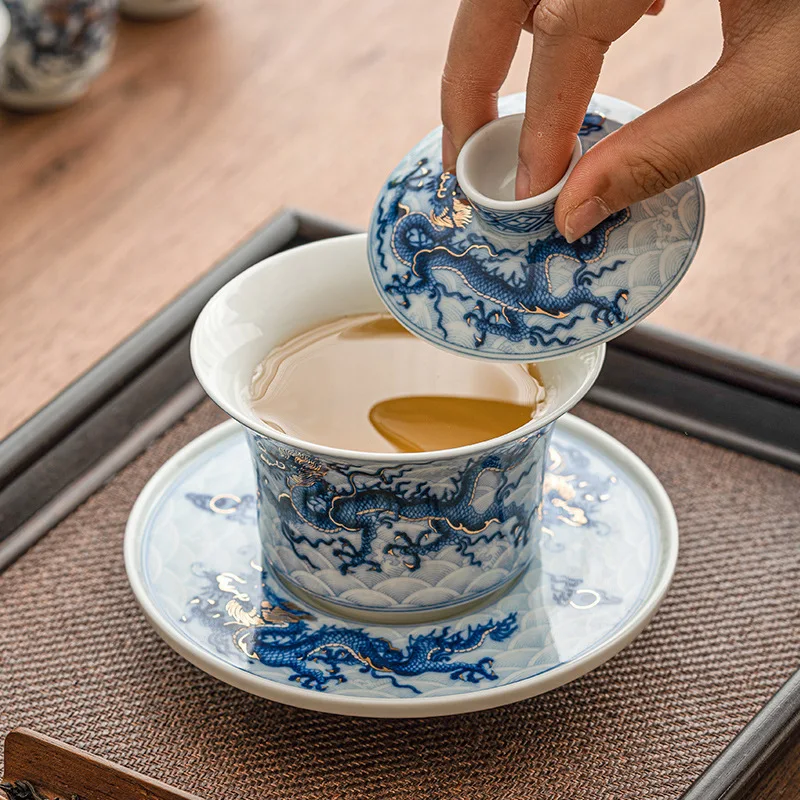 Gold and Silver Mixed Blue and White Dragon Pattern Three-talent Covered Bowl Single High-end Chinese Ceramic Kung Fu Tea Set
Gold and Silver Mixed Blue and White Dragon Pattern Three-talent Covered Bowl Single High-end Chinese Ceramic Kung Fu Tea Set