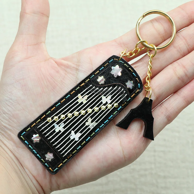 Mini vintage leather zither keychain bag pendant handmade leather accessory gift exquisite and beautiful decoration
Mini vintage leather zither keychain bag pendant handmade leather accessory gift exquisite and beautiful decoration